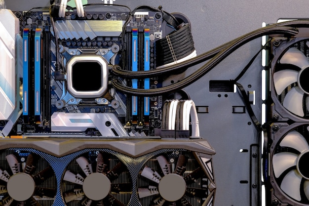 An organized PC case during the building process, showing the motherboard, CPU cooler, SSD, and RAM installed, with cables neatly managed. The image should convey a sense of accomplishment and order.