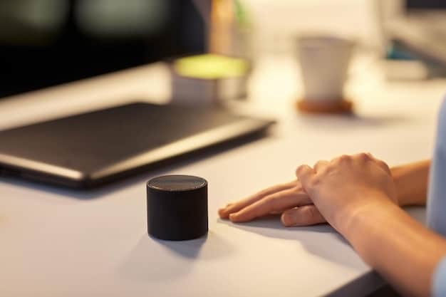 A close-up of a sleek, cylindrical AI-powered personal assistant device on a desk. The device is displaying a holographic interface with task management options, calendar appointments, and communication notifications. The background is a modern home office setup.