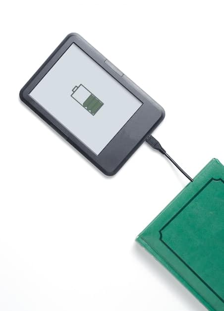 An e-reader displaying a low battery warning symbol, but with an accompanying text indicating exceptional battery life, emphasizing the advancements in battery technology.